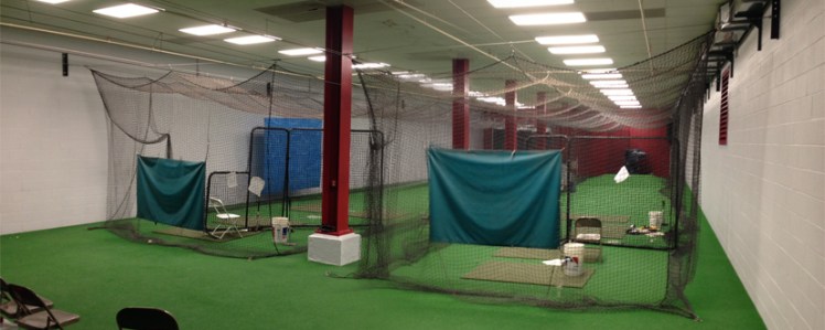 The batting cages now feature red columns and a much softer off-white paint along the sides.